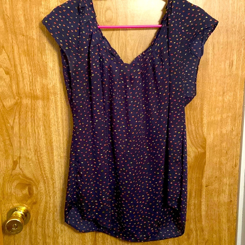 Navy blue blouse with pink flowers ties in back around neck